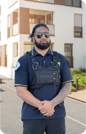 Security guard standing in front of residential houses